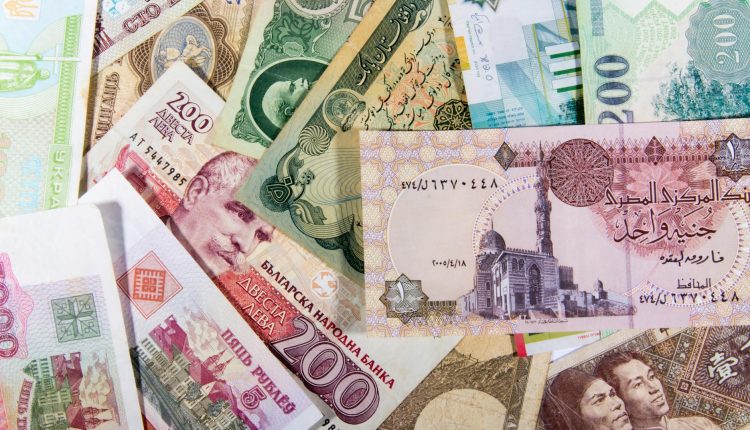 A vibrant collection of various international banknotes showcasing global diversity.