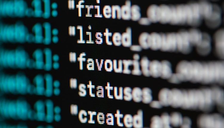 Extreme close-up of computer code displaying various programming terms and elements.